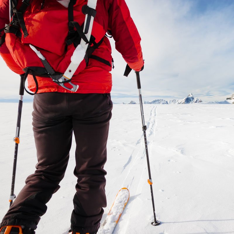 mountaineer-exploring-a-glacier-with-the-skis-PZWYW5Q.jpg